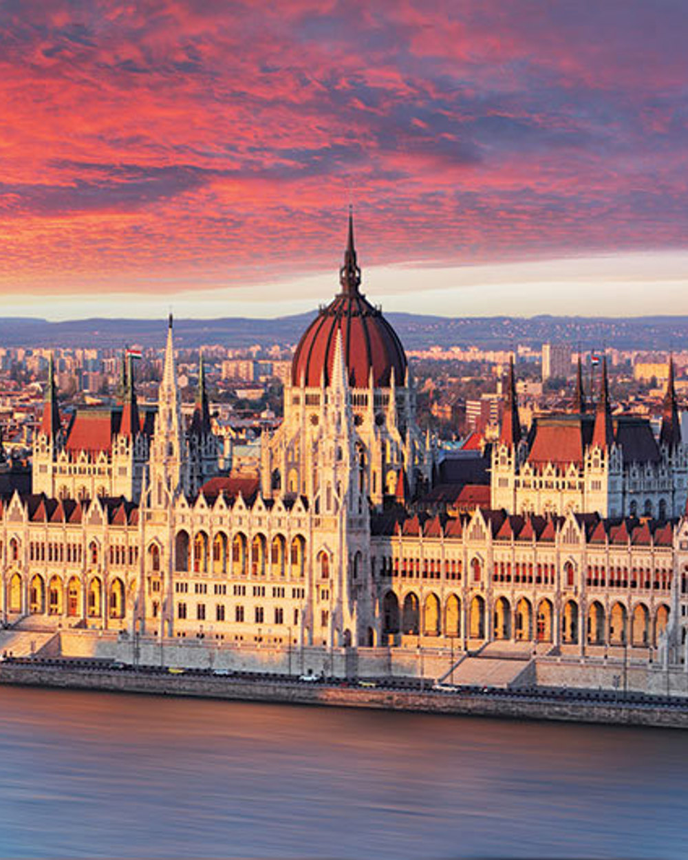 Hungarian Parliament on the Danube in Budapest at dusk
