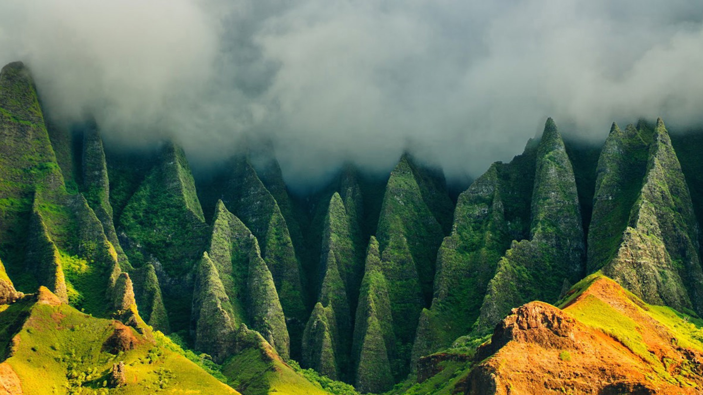 The Nā Pali Coast cliffs on Kauaʻi rising above the ocean