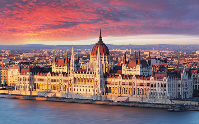 Hungarian Parliament on the Danube in Budapest at dusk
